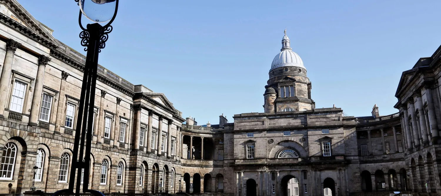 Old College building with grass quad 