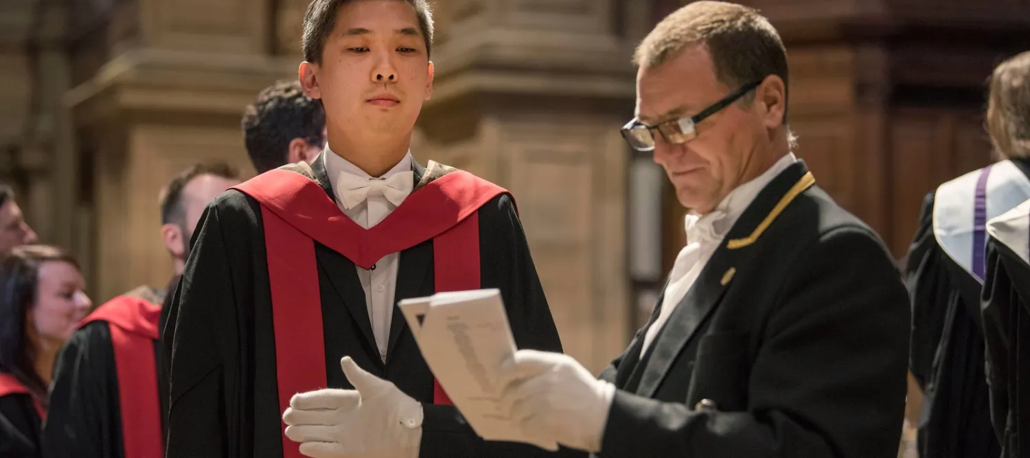 Student and Servitor at Graduation Ceremony 