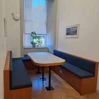 A table with benches in a room