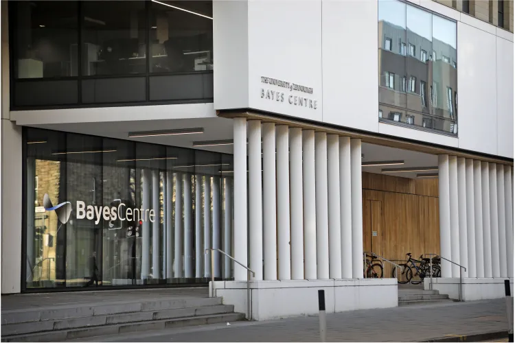 Close up of Bayes Centre Building with thin white pillars 